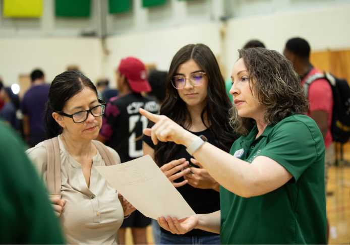Image of an admissions counselor assisting a student.